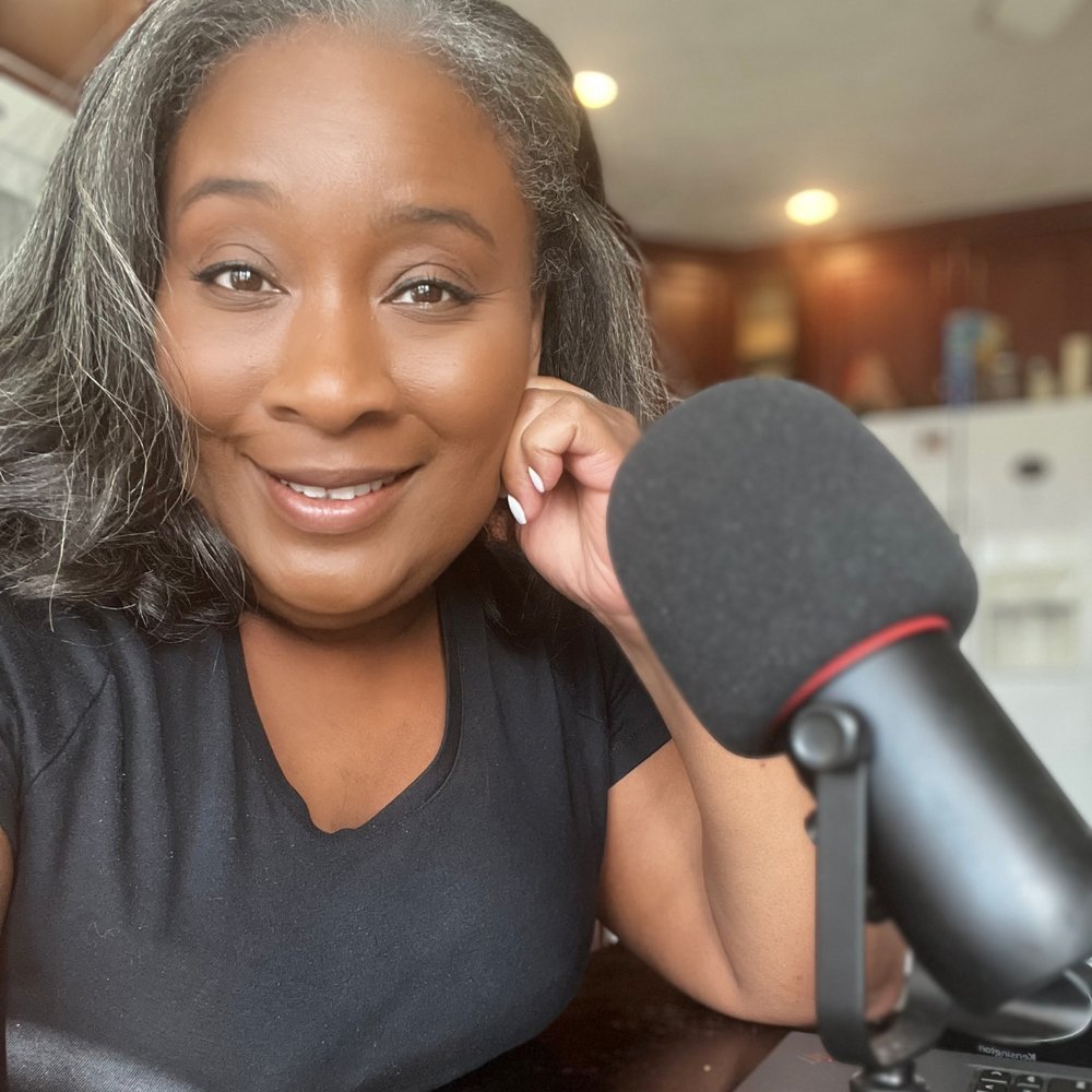 Tonia Emanuel, founder of Coach You 360, recording at her kitchen table